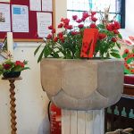 Image of the War Memorial and exquisite, hand-made tumbling Poppies.